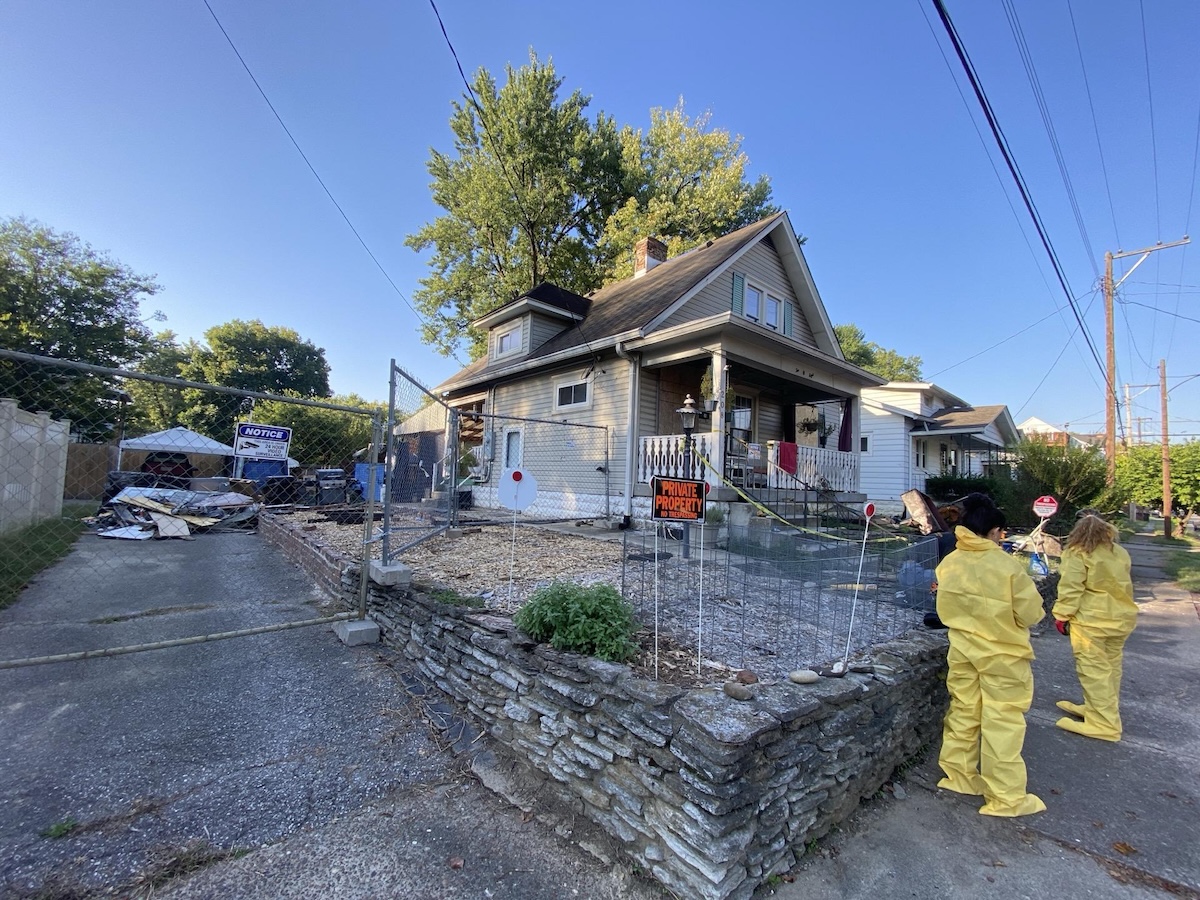 Monarch Restoration specialists inspecting the exterior of home.