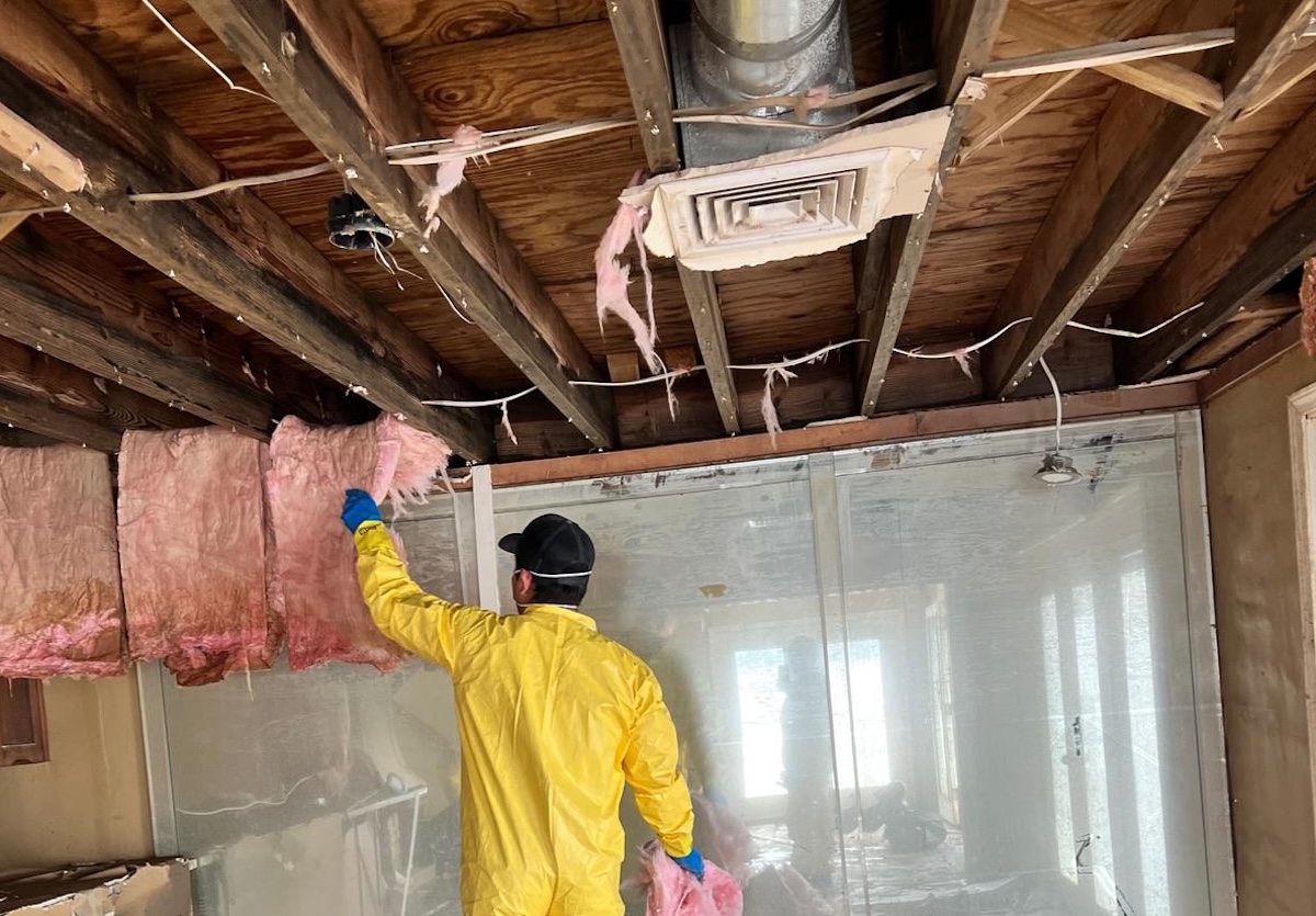 Monarch Restoration specialists removing wet insulation.